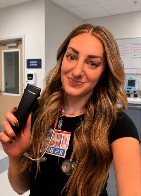 Registered nurse Madison holding a MANSPOT body trimmer in a clinical setting